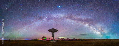 In observatories, satellite antenna radio telescope on the background of stellar tracks, radio telescope on the background of stellar tracks,  The observatory's radio telescope