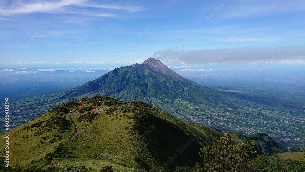 view of active Merapi volcano from the top of mount Merbabu