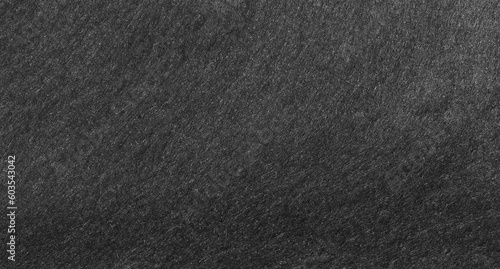 Black felt abstract background texture. Surface of fabric texture in dark color for copy space. 