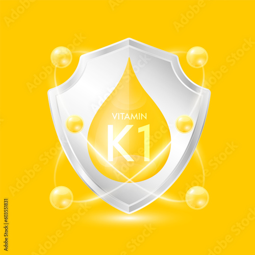 Vitamin K1 yellow drop inside aluminum silver shield with atom surround. Minerals and vitamins complex protect the body stay healthy. For nutrition products food. Vector EPS10 illustration.