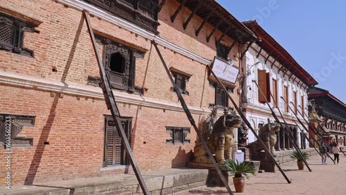 Historic National Art Museum in Bhaktapur Durbar Square being held up by wood planks after the 2015 earthquake, Kathmandu Valley, Nepal photo
