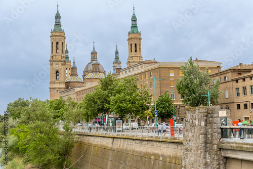 Zaragoza, Spain - May 01, 2023: tourists strolling in the square in front of the basilica of El Pilar in Zaragoza, Spain photo