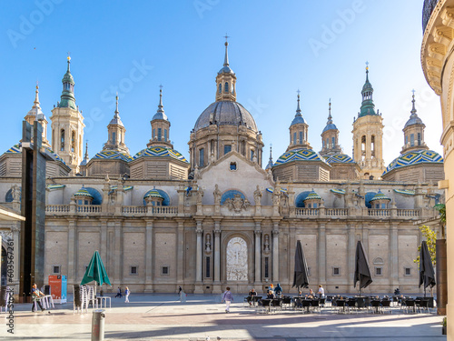 Zaragoza, Spain - May 01, 2023: tourists strolling in the square in front of the basilica of El Pilar in Zaragoza, Spain photo