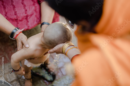 A Hindu religious ceremony where a child's head is shaved is called mundan. photo