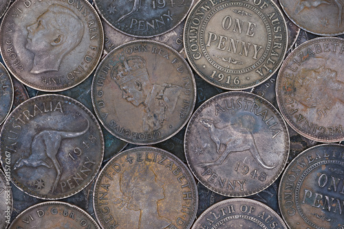 Flat top view montage of old bronze Australian penny coins filling the frame soft lighting  photo