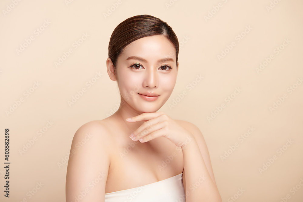 Beautiful young asian woman with clean fresh skin on beige background, Face care, Facial treatment, Cosmetology, beauty and spa, Asian women portrait. Beautiful young asian woman with clean fresh skin on beige background, Face care, Facial treatment, Cosmetology, beauty and spa, Asian women portrait.