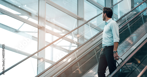 Fotografía Airport, travel and a business man on escalator with his luggage for a trip abroad or overseas