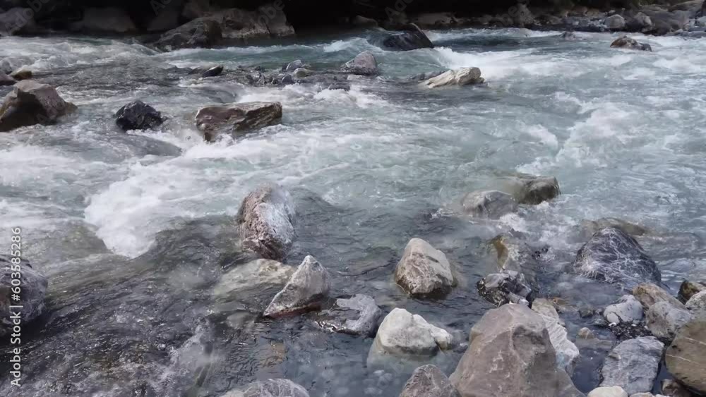 Kander river: shallow Glacier white meltwater rapids flowing through rocky gorge. in swiss alps of Kandertal, switzerland. Kander river: shallow Glacier white meltwater rapids flowing through rocky gorge. in swiss alps of Kandertal, switzerland.
