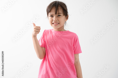 Portrait of cute girl thump up isolated on white background