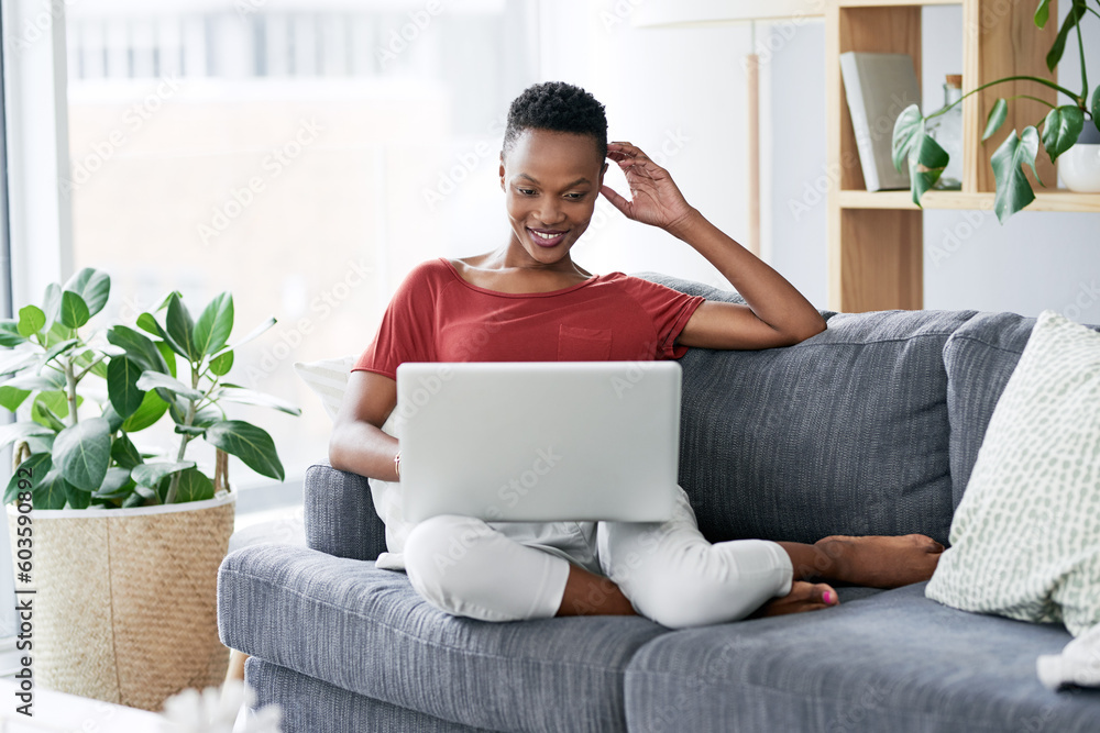 Happy, black woman and relax with laptop on a sofa, comfortable and chilling on the weekend. Streaming, smile and African female person online for internet, search and subscription in a living room Happy, black woman and relax with laptop on a sofa, comfortable and chilling on the weekend. Streaming, smile and African female person online for internet, search and subscription in a living room