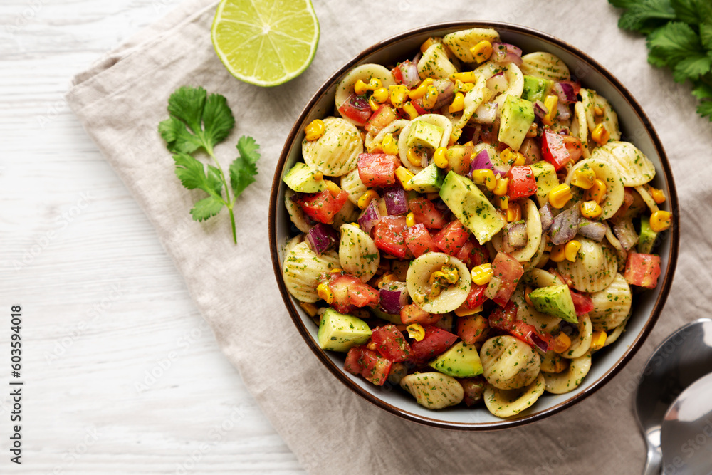 Homemade Grilled Corn Summer Pasta Salad in a Bowl on a white wooden background, top view. Flat lay, overhead, from above. Homemade Grilled Corn Summer Pasta Salad in a Bowl on a white wooden background, top view. Flat lay, overhead, from above.