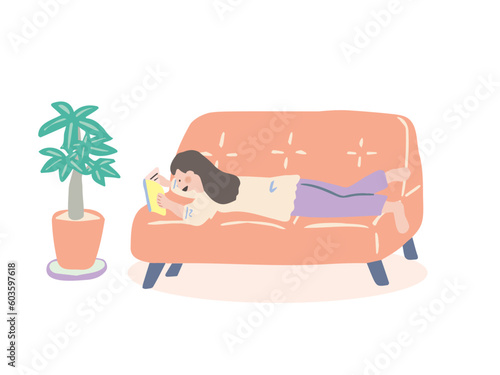 ソファに寝転がって本を読む人