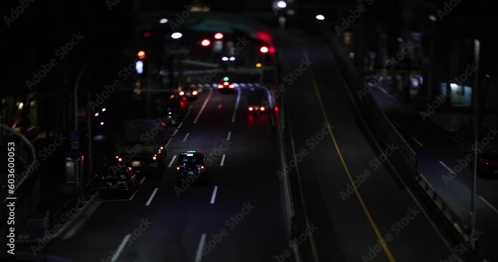 A night cityscape of the miniature traffic jam at the urban city street A night cityscape of the miniature traffic jam at the urban city street