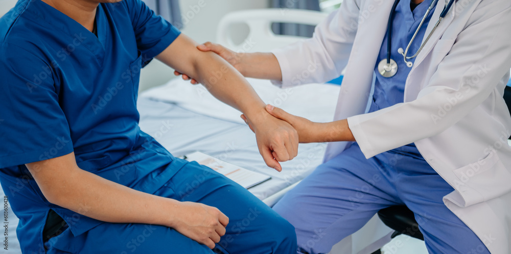 Doctor consulting with patient Back problems Physical on the bed in clinic concept . Doctor consulting with patient Back problems Physical on the bed in clinic concept .