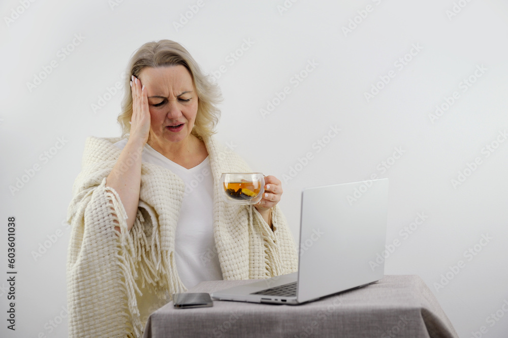 Ill brunette girl is sitting at sofa and working remotely on laptop. Female is blowing out snot, having fever and headache. Young woman is treated at home, took sick leave. Winter cold and flu Ill brunette girl is sitting at sofa and working remotely on laptop. Female is blowing out snot, having fever and headache. Young woman is treated at home, took sick leave. Winter cold and flu