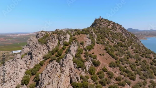 Alange Castle on the mountain overlooking the Matachel River and Alange reservoir photo