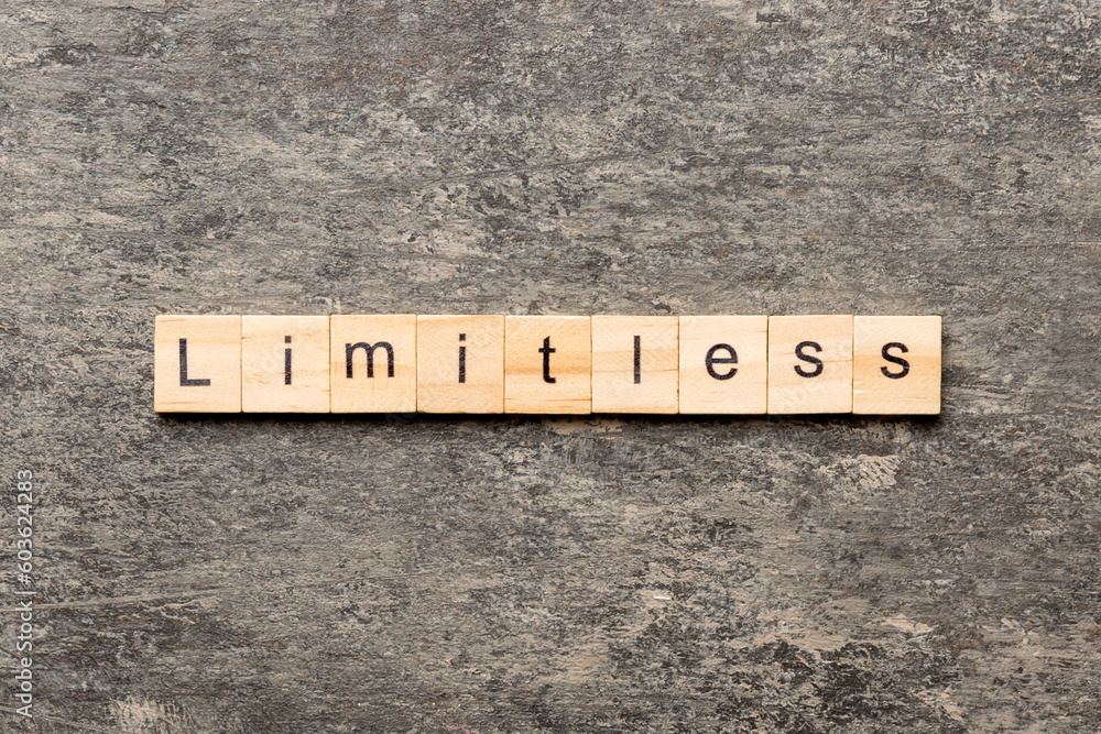 Limitless word written on wood block. Limitless text on cement table for your desing, concept Limitless word written on wood block. Limitless text on cement table for your desing, concept