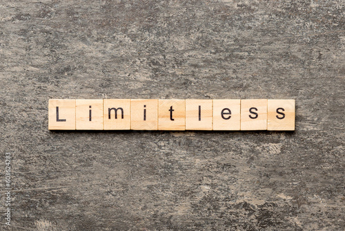 Limitless word written on wood block. Limitless text on cement table for your desing, concept photo