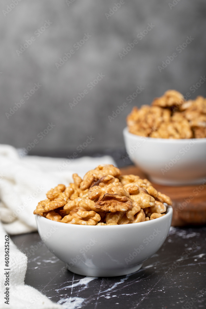 Walnut. Fresh walnuts in a ceramic bowl. superfood. Vegetarian food concept. healthy snacks. Close up Walnut. Fresh walnuts in a ceramic bowl. superfood. Vegetarian food concept. healthy snacks. Close up
