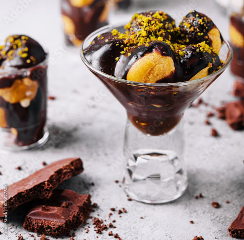 Fotografie French cuisine, tasty dessert profiteroles with hot chocolate