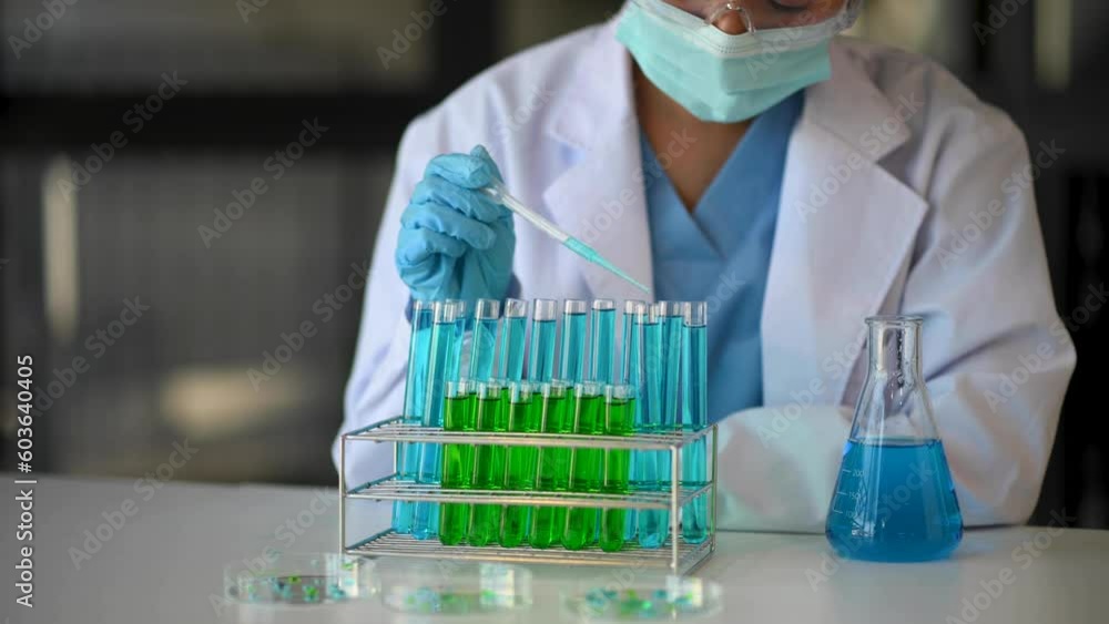 Modern medical research laboratory. female scientist working with micro pipettes analyzing biochemical samples, advanced science chemical laboratory . Modern medical research laboratory. female scientist working with micro pipettes analyzing biochemical samples, advanced science chemical laboratory .