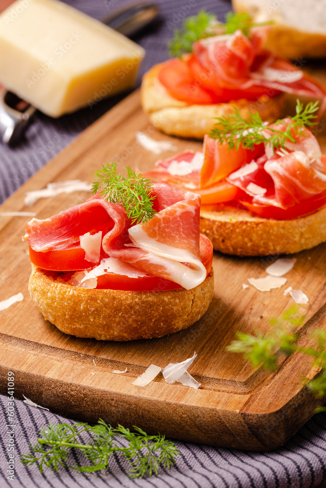 Savory Delights: Mini Rolls with Parma Ham, Parmesan Cheese, and Dill Deli-Style, an Artisanal Combination of Italian Flavors for Elegant Bite-Sized Appetizers