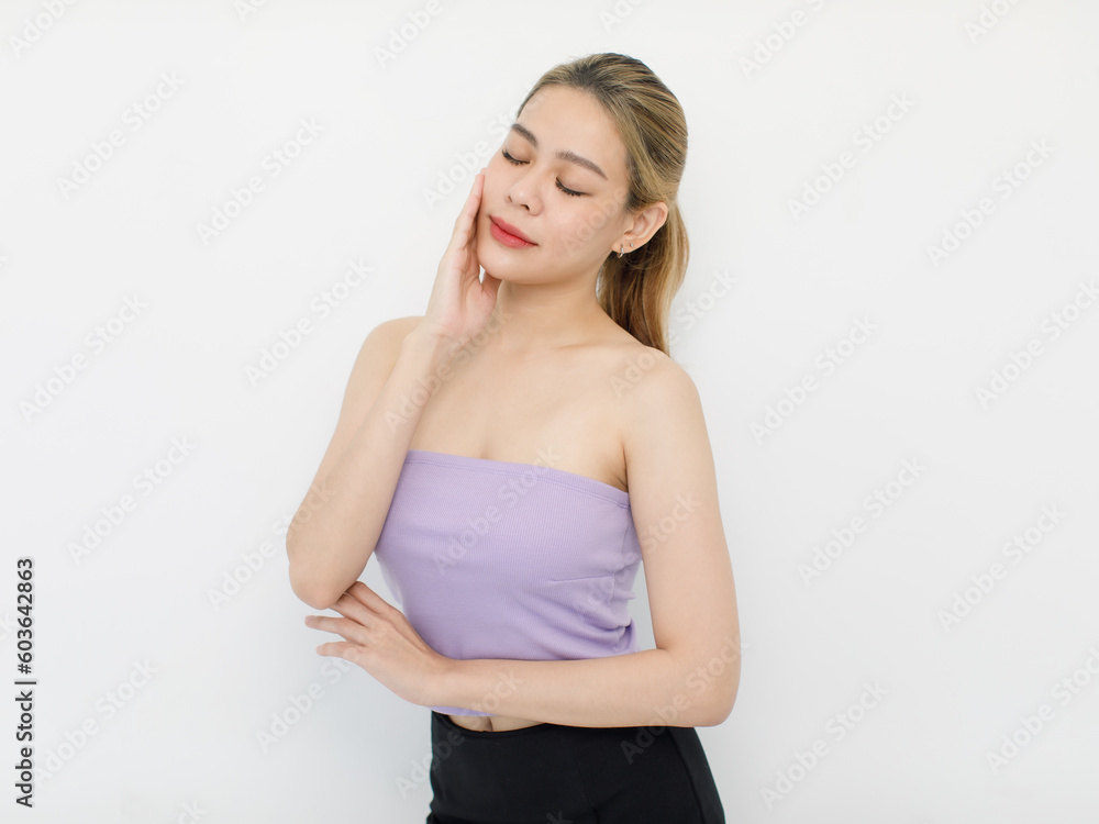 Portrait isolated cutout closeup shot of millennial Asian young beautiful sexy long hair model in seamless tube cropped top standing posing crossed arms look at camera on white background copy space Portrait isolated cutout closeup shot of millennial Asian young beautiful sexy long hair model in seamless tube cropped top standing posing crossed arms look at camera on white background copy space
