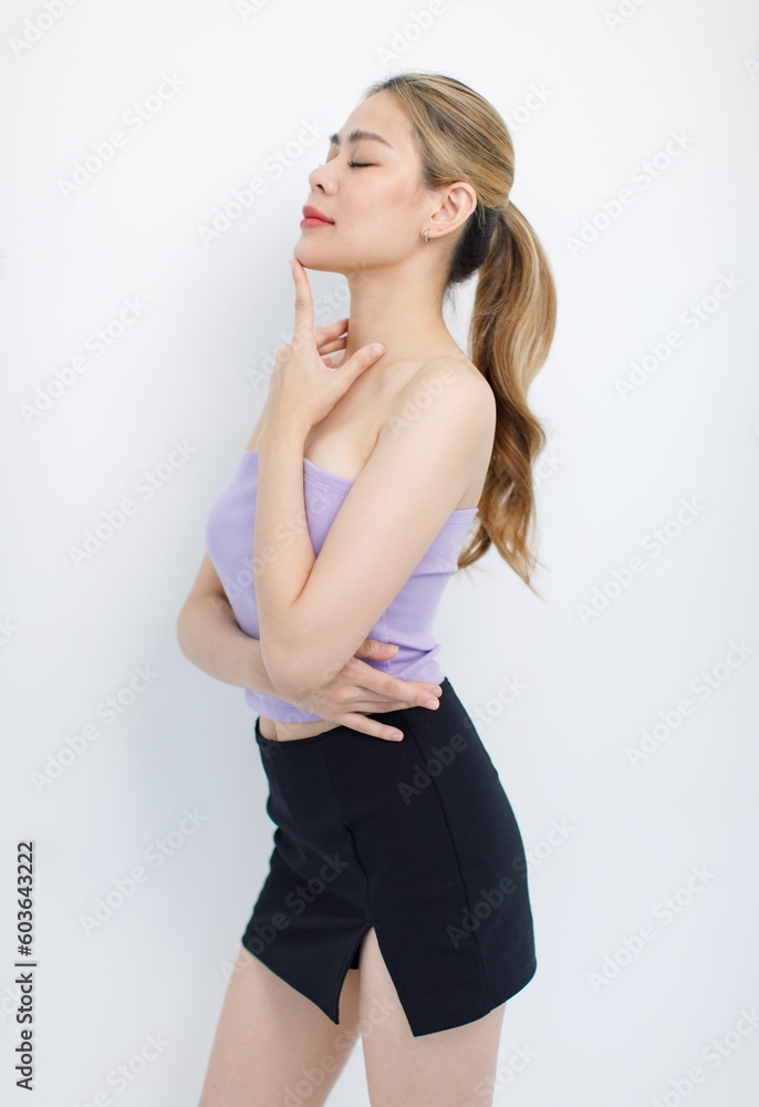 Portrait isolated cutout closeup shot of millennial Asian young beautiful sexy long hair model in seamless tube cropped top standing posing crossed arms look at camera on white background copy space Portrait isolated cutout closeup shot of millennial Asian young beautiful sexy long hair model in seamless tube cropped top standing posing crossed arms look at camera on white background copy space