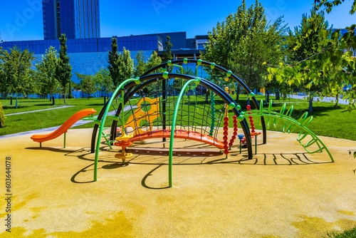 Colorful playground outside the apartment for children to relax and play with safety