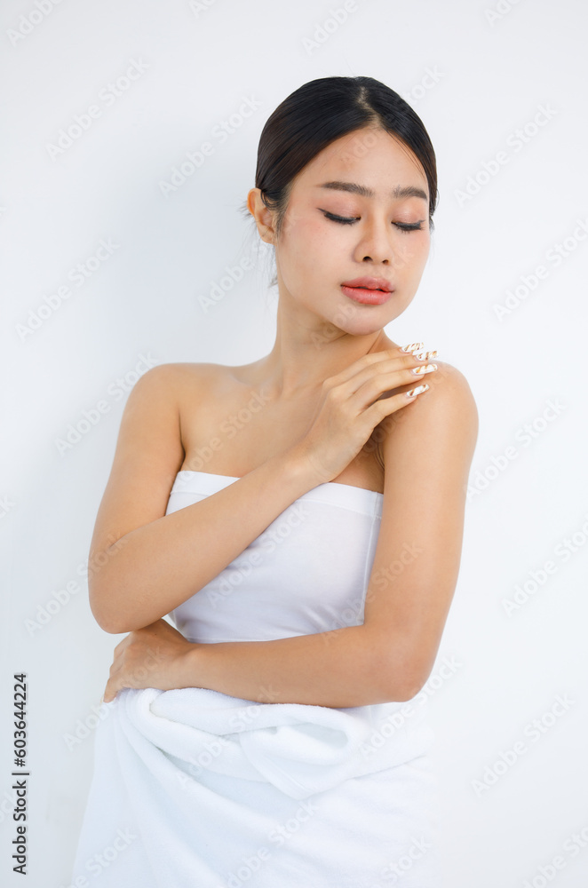 Isolated cutout studio shot millennial Asian beautiful pretty sexy female model in tube cropped top shirt standing smiling holding hand on face showing presenting painting nails on white background Isolated cutout studio shot millennial Asian beautiful pretty sexy female model in tube cropped top shirt standing smiling holding hand on face showing presenting painting nails on white background