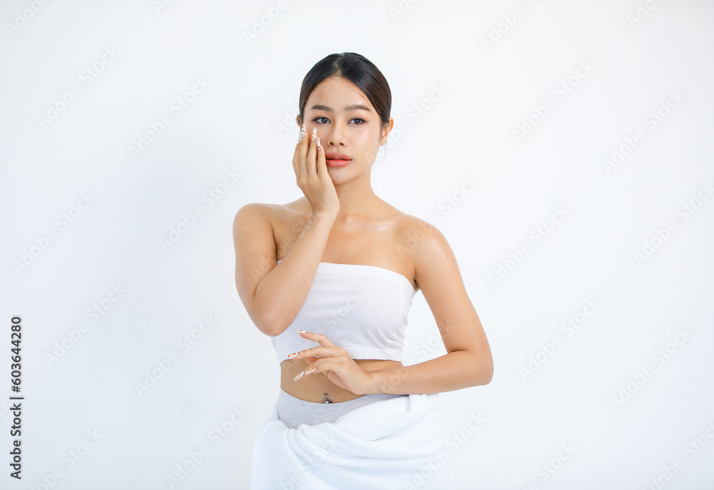Isolated cutout studio shot millennial Asian beautiful pretty sexy female model in tube cropped top shirt standing smiling holding hand on face showing presenting painting nails on white background Isolated cutout studio shot millennial Asian beautiful pretty sexy female model in tube cropped top shirt standing smiling holding hand on face showing presenting painting nails on white background