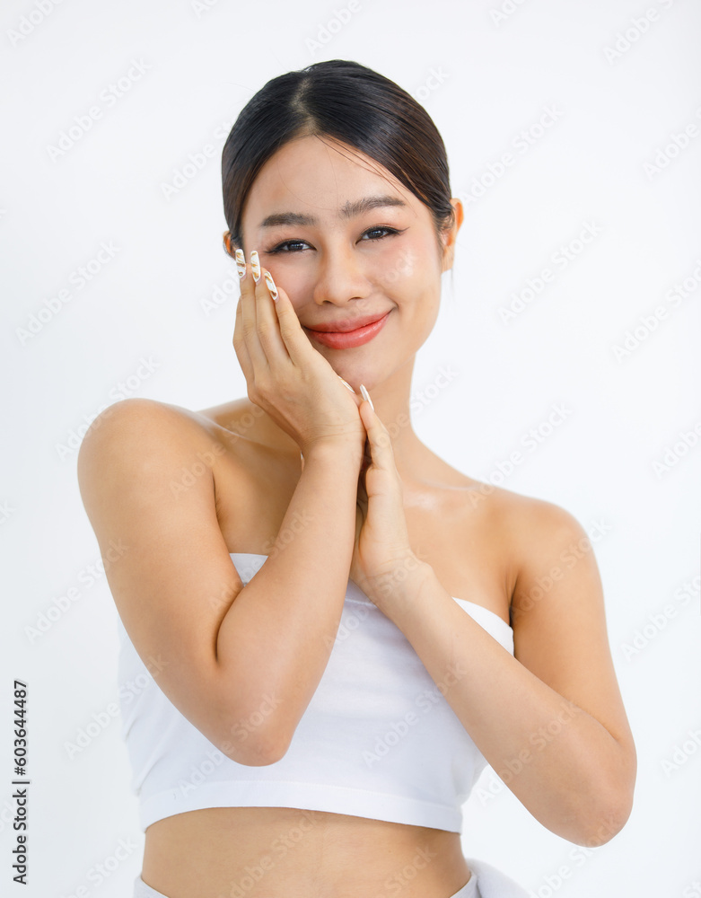 Isolated cutout studio shot millennial Asian beautiful pretty sexy female model in tube cropped top shirt standing smiling holding hand on face showing presenting painting nails on white background Isolated cutout studio shot millennial Asian beautiful pretty sexy female model in tube cropped top shirt standing smiling holding hand on face showing presenting painting nails on white background
