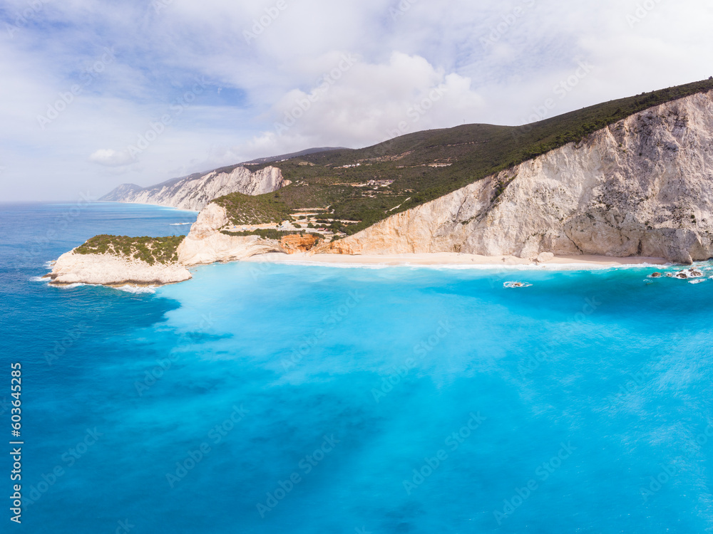 Aerial beautiful beach and water bay in the greek spectacular coast line. Turquoise blue transparent water, unique rocky cliffs, Greece summer top travel destination Lefkada island