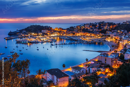 Port de Soller during sunset. Beautiful dusk at travel destination in Mallorca, Spain. Illuminated old town of the Balearic Islands photo