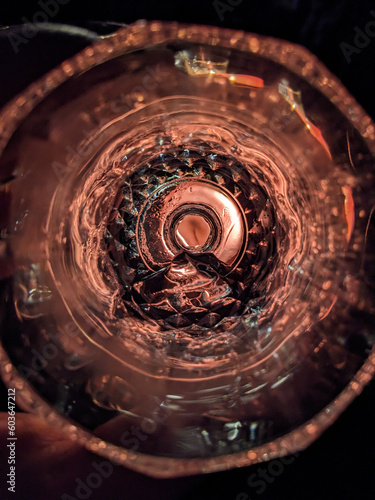A glass with a spiral pattern of the bottom