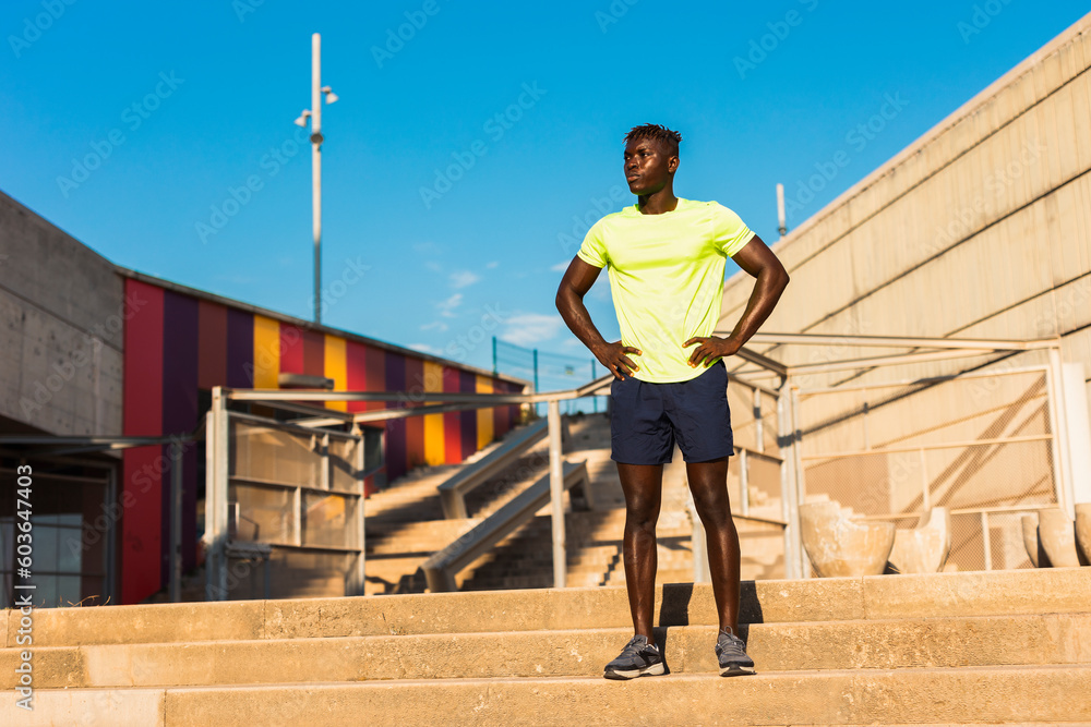 Fitness training outdoors. Handsome African man doing exercises outside. Muscular man training. Fitness training outdoors. Handsome African man doing exercises outside. Muscular man training.