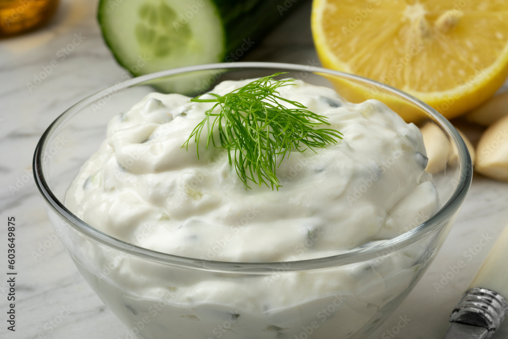 Glass bowl with traditional Greek tzatziki close up Glass bowl with traditional Greek tzatziki close up