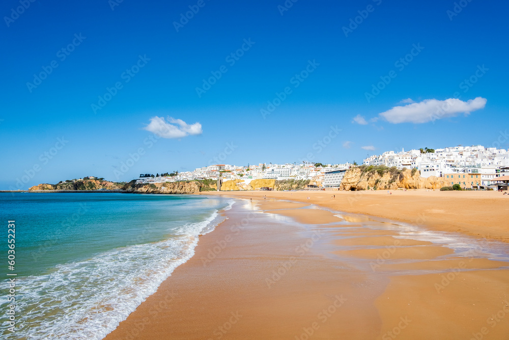 Great view of Fisherman Beach, Praia dos Pescadores, with whitewashed houses on cliff, Albufeira, Algarve, Portugal