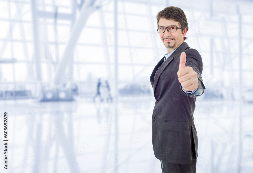 businessman thumb up at the office businessman thumb up at the office