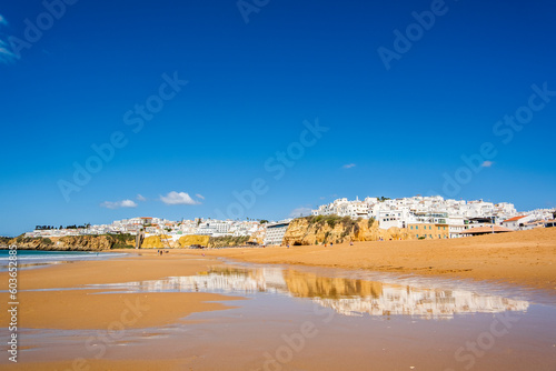 Great view of Fisherman Beach, Praia dos Pescadores, with whitewashed houses on cliff, Albufeira, Algarve, Portugal