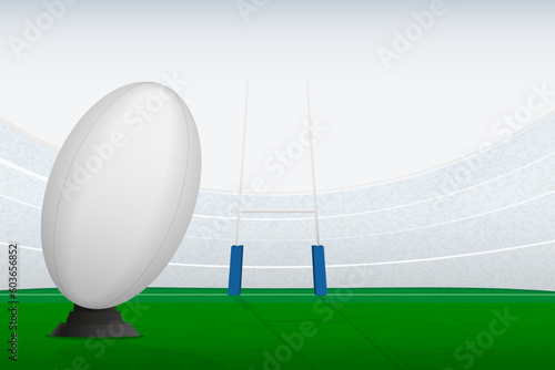 Rugby ball on stadium filed and rugby goal posts.