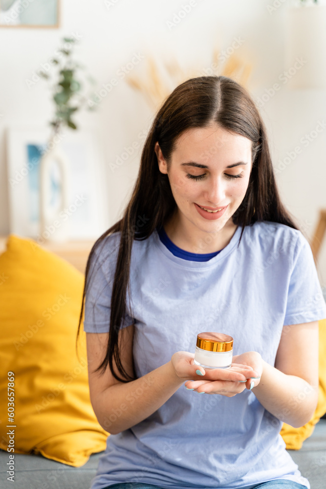 Woman applying moisturizing lotion on her hand. Woman applying moisturizing lotion on her hand.