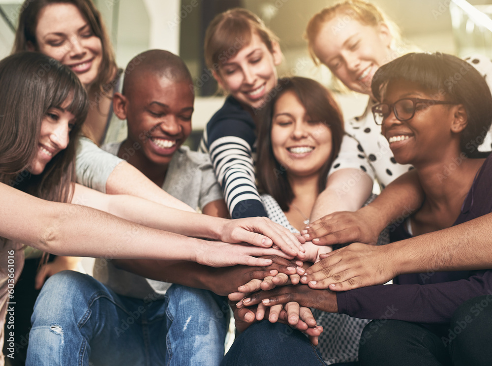 Obraz premium Goal, motivation and friends with their hands in a huddle together for education, support or success. Teamwork, smile and trust with a happy group of students bonding at college or university