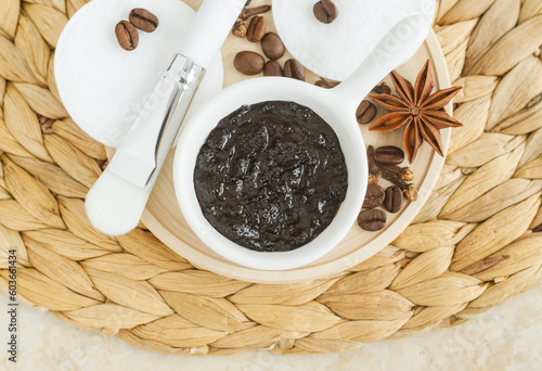 Homemade exfoliating foot and body aroma scrub with ground coffee, olive oil, cinnamon, star anise and clove. Natural beauty treatment and spa recipe. Top view.