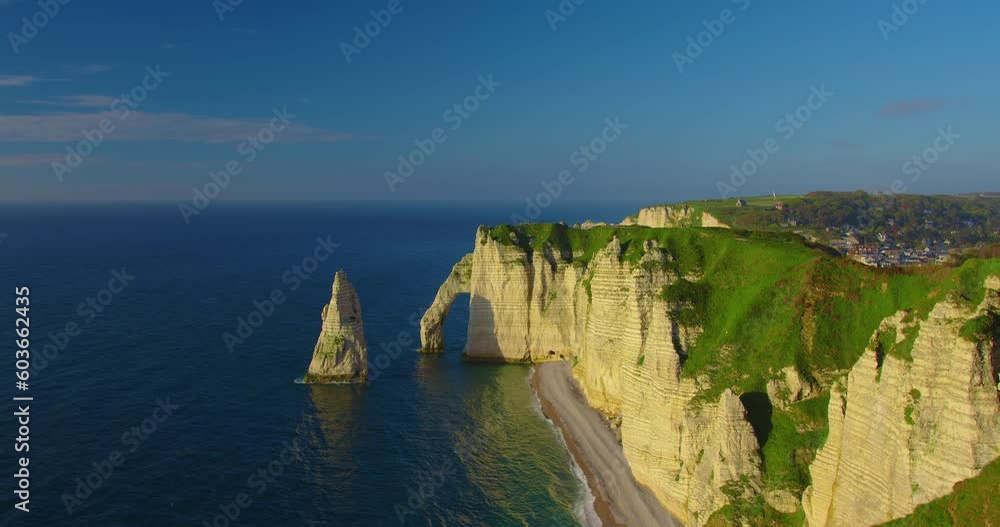 Environmental protection in France. Care for nature. Establishing shot beautiful rocky coast of the Atlantic ocean in France at sunset. Most visited attractions in France, Etretat Environmental protection in France. Care for nature. Establishing shot beautiful rocky coast of the Atlantic ocean in France at sunset. Most visited attractions in France, Etretat