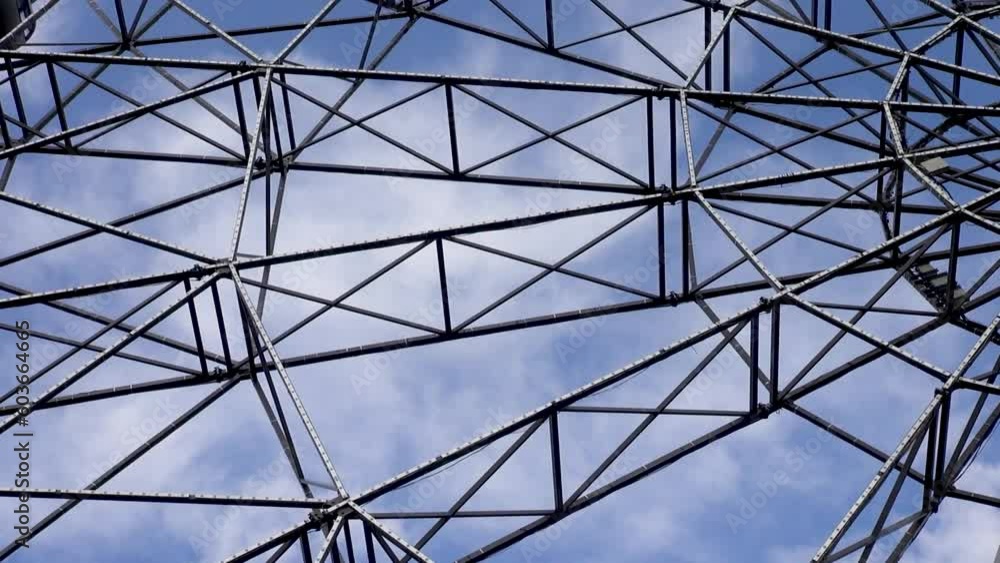 Metal trusses of a steel structure moving in space Metal trusses of a steel structure moving in space