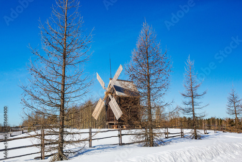 Wooden windmill in Malye Korely architecture museum, Arkhangelsk region in Russia photo