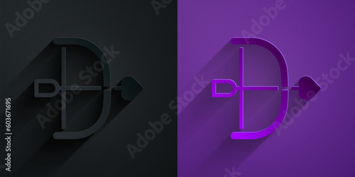 Paper cut Bow and arrow icon isolated on black on purple background. Cupid symbol. Love sign. Happy Valentines day. Paper art style. Vector