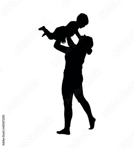 Mom playing and lifting her baby son up overhead silhouette.