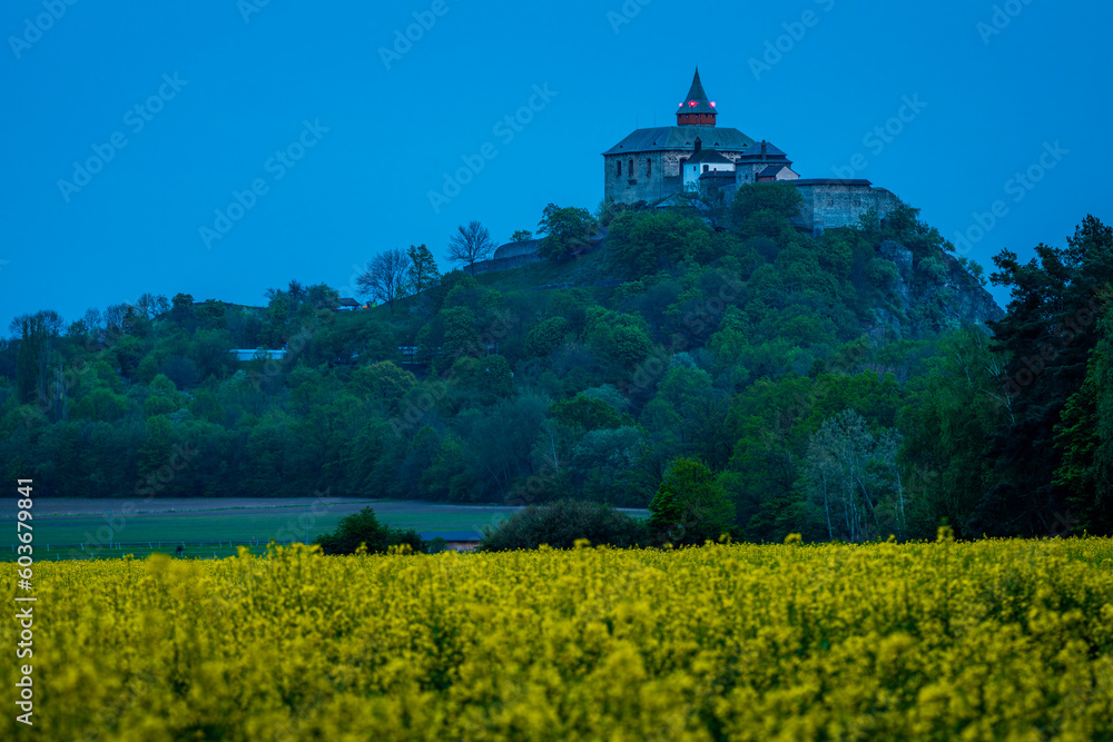 Kuneticka hora castle in Czechia in blue hour after sunset.